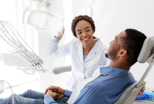 female dentist turning on lamp before treatment CNVTG6H 1 - Blog