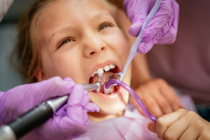little girl at the dentist P8MPG3W 300x200 - Back to School Dental Appointments